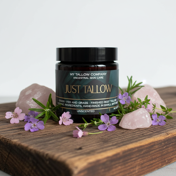 Just Tallow jar on wood with flowers and quartz